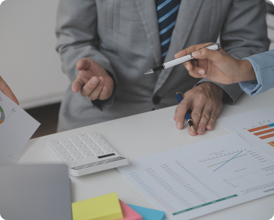 Finance advisors reviewing charts and calculations